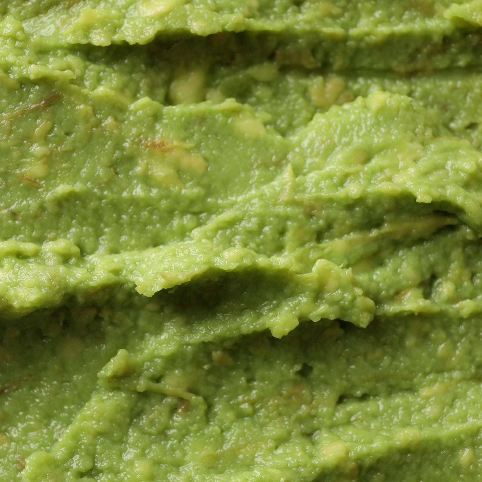 close up of mashed avocado texture