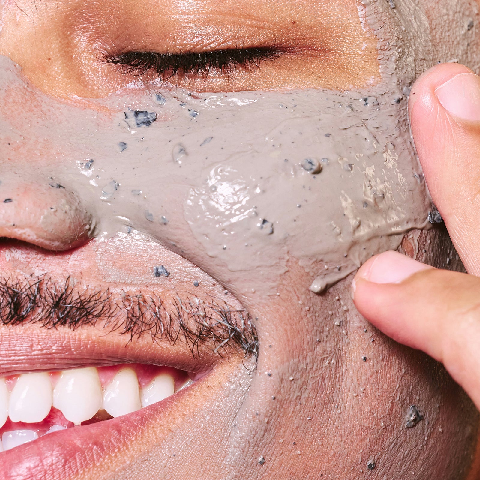 a person applying a face mask
