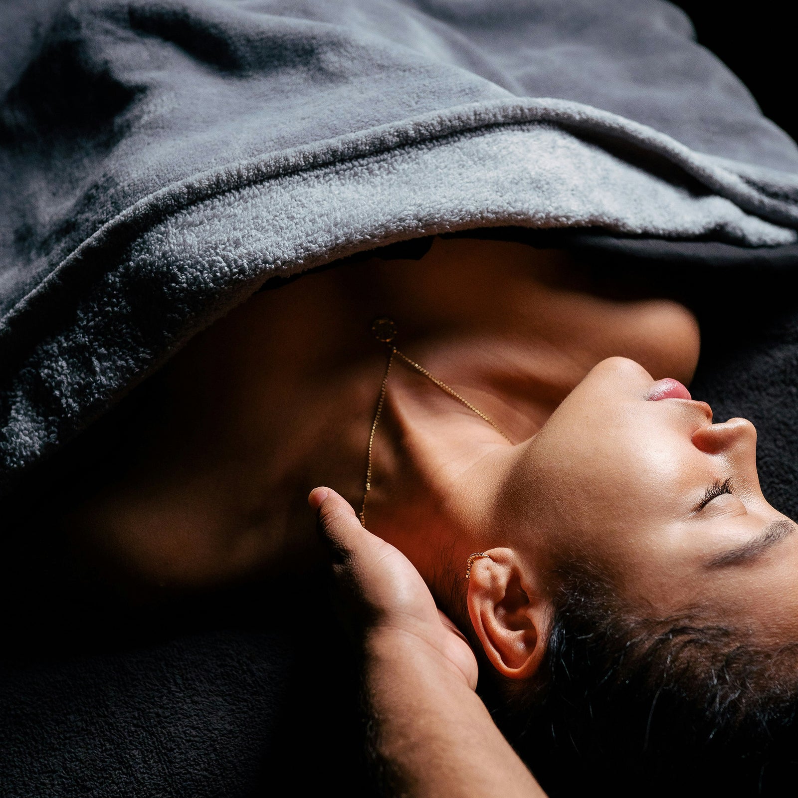 a person receiving a massage from their partner